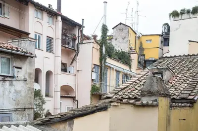 a group of buildings and roofs in a city at Collection Spanish Steps Apartments in Rome