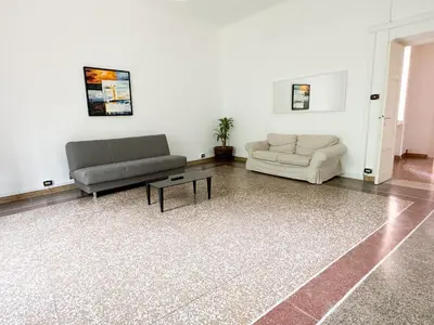 a living room with two couches and a coffee table at Angelico Boutique Apartment in Rome