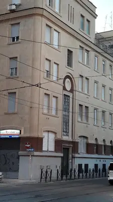 a large building on the side of a street at Holidays S.Lorenzo Guest House New in Rome
