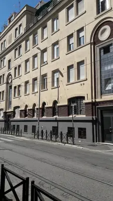 a large building on the side of a street at Holidays S.Lorenzo Guest House New in Rome