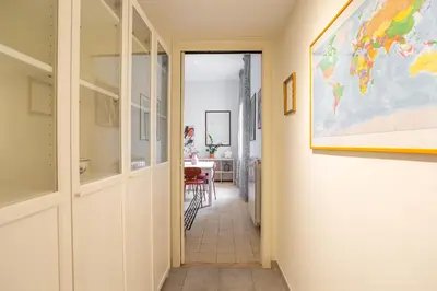 a hallway with a map of the world on the wall at Casa Stella in Rome