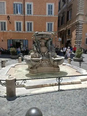 a fountain in the middle of a street at Harmony in Rome in Rome