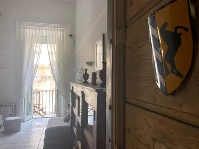 a living room with a door with a window and a room with at NEW! BELLISSIMO PalazzoFranchi Pantheon in Rome