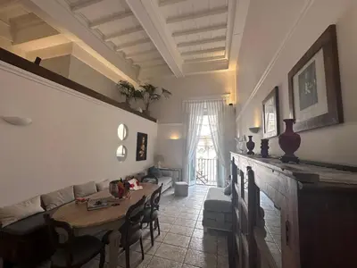 a living room with a table and a couch at NEW! BELLISSIMO PalazzoFranchi Pantheon in Rome