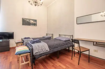 a bathroom with a shower and a toilet and a sink at Long John Apartment in Rome