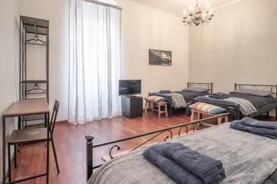 a bedroom with a bed with blue towels on it at Long John Apartment in Rome