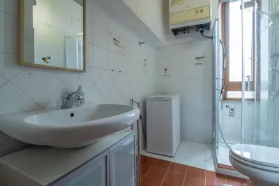 a bedroom with a bed with blue towels on it at Long John Apartment in Rome