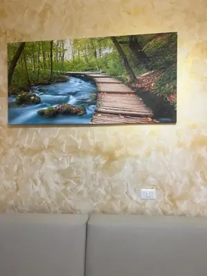 a painting of a wooden bridge over a river at Termini Golden house in Rome
