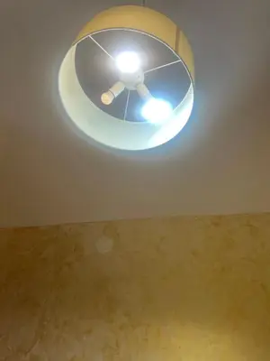 a ceiling light with a ceiling fan in a room at Termini Golden house in Rome