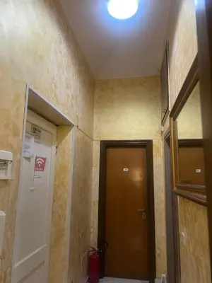 a hallway with a door and a room with a hallway at Termini Golden house in Rome
