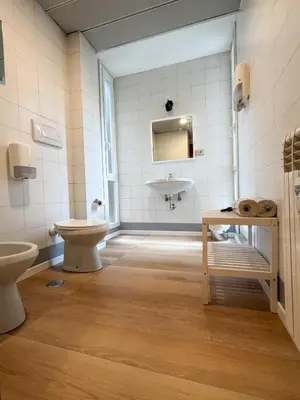 a bathroom with a toilet and a sink at Mazzini Boutique Apartment in Rome