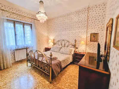 a bedroom with a bed and a television in it at Grazia Guesthouse in Rome