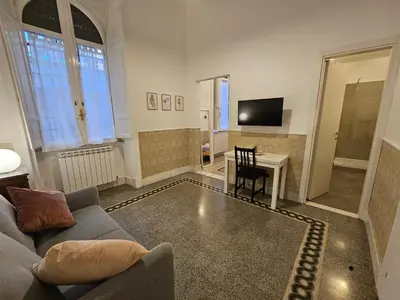 a living room with a couch and a table at 4rooms In Rome in Rome