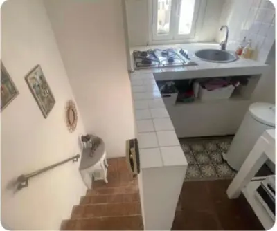 a small bathroom with a sink and a toilet at La Rosa di piazza Spagna in Rome