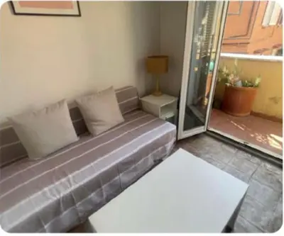 a couch in a living room with a window at La Rosa di piazza Spagna in Rome