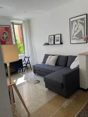 a living room with a couch and a table at House of Mia in Prati in Rome
