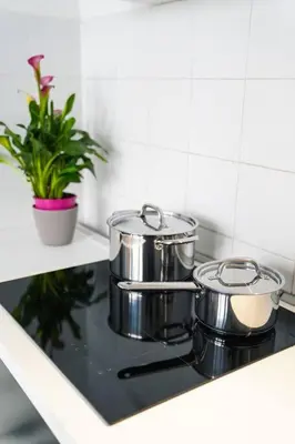 two pots and pans on a stove in a kitchen at babuino terrace in Rome