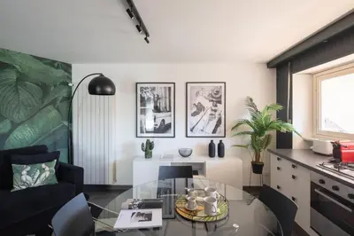 a living room with a glass table and a couch at Loft 36 by Nosdom Properties in Rome