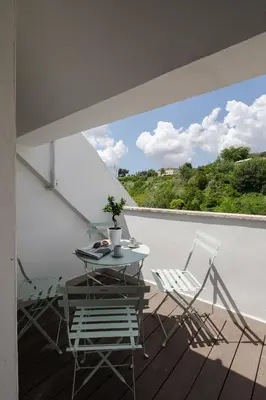 a table and chairs on a balcony with a view at Loft 36 by Nosdom Properties in Rome