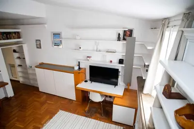 a room with a desk with a computer on it at Tamara e Gerardina House in Trastevere in Rome