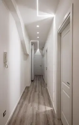 a room with a white ceiling with a light at Guest house San Lorenz in Rome