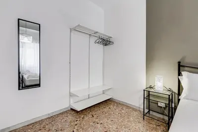 a glass shower in a bedroom with a mirror at BDC - Egeria 3-Bdr huge apartment in Rome