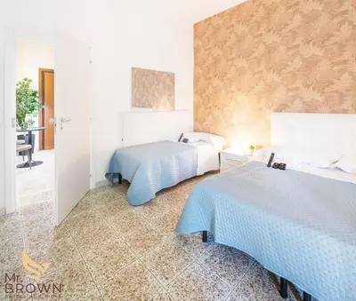 a bedroom with two beds in a room at Mr. Brown - Marconi in Rome