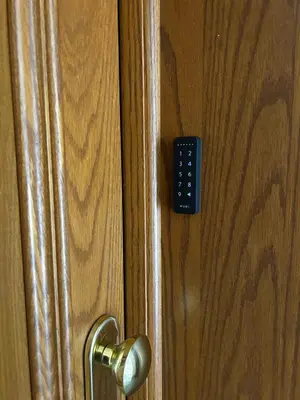 a close up of a door with a remote control at Vita lenta terrazza Roma Garbatella in Rome