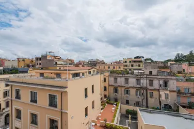a view of a city with buildings at Colosseum Loft - ZENO 12 in Rome