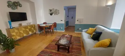 a living room with a couch and a table at Colosseo 500 m Quiete in città A Casa di Beatrice in Rome