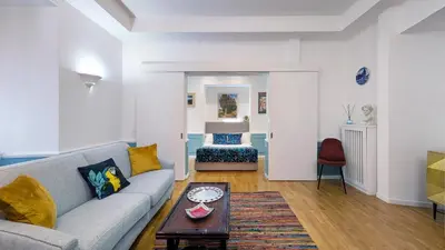 a living room with a couch and a table at Colosseo 500 m Quiete in città A Casa di Beatrice in Rome