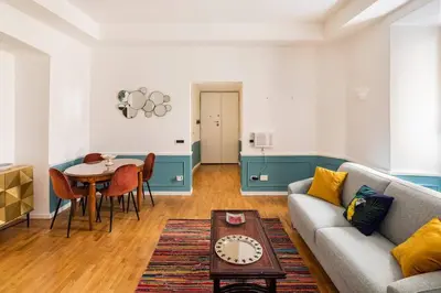 a living room with a couch and a table at Colosseo 500 m Quiete in città A Casa di Beatrice in Rome