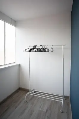 a white room with a shelf with graffiti on the wall at Belvedere pigneto in Rome