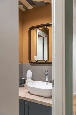 a bathroom with a sink and a mirror at Residenza Clodio Vatican in Rome