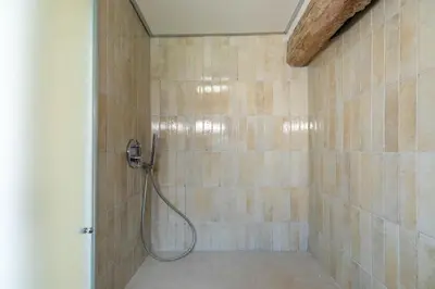 a shower with a hose in a bathroom at iFlat Penthouse in Campo de' Fiori in Rome