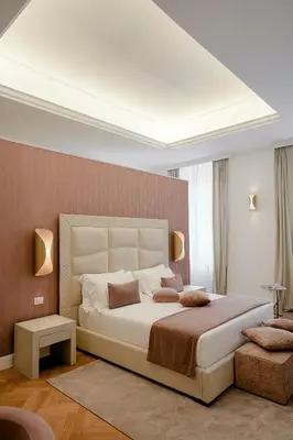 a bedroom with a large bed in a room at Màs Boutique Hotel Rome in Rome