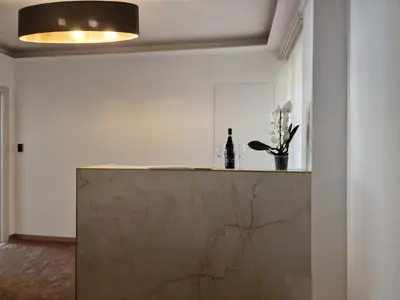 a kitchen with a marble counter top in a room at Cuma Suites in Rome