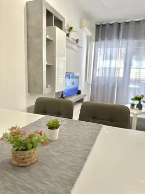 a room with a table with two plants on it at Maison DaLù in Rome