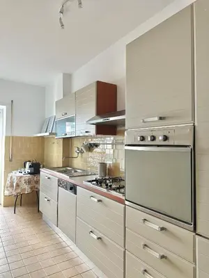 a large kitchen with stainless steel appliances at Maison DaLù in Rome