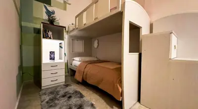 a small bedroom with a bed and a bunk bed at Sina Rent Room in Rome