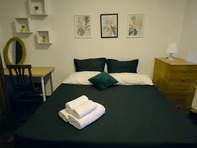 a bedroom with a bed with two towels on it at The italian House in Rome a pochi passi dalla metro A in Rome