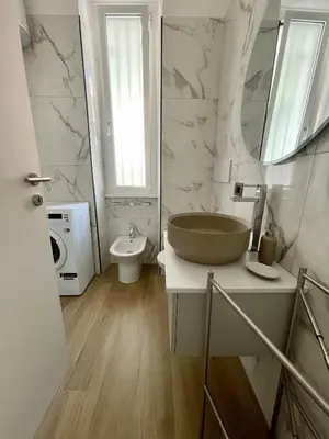 a bathroom with a sink and a toilet at Aurelia's Hideaway, Near Vatican in Rome