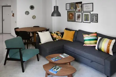a living room with a couch and a table at Aurelia's Hideaway, Near Vatican in Rome