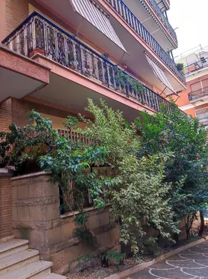 a building with stairs and a balcony on it at Vacanze romane in Rome