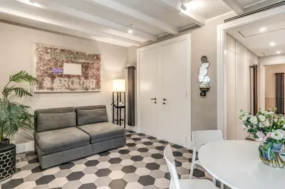 a living room with a couch and a table at Ibernesi Luxury Home in Rome