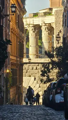 a couple of people walking down a street at Ibernesi Luxury Home in Rome
