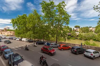a city street filled with lots of cars and motorcycles at Daplace - Beatrice Apartment in Rome