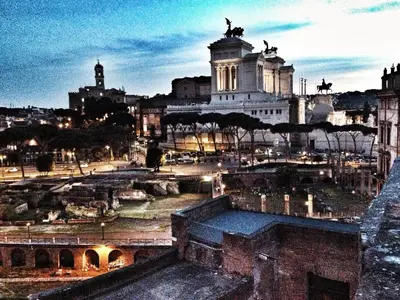 a view of a city at night at The Avalon in Rome