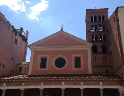 a building with a round window and a clock tower at The Avalon in Rome