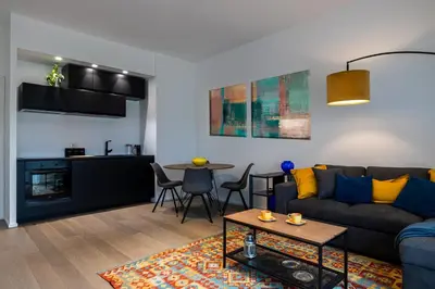 a living room with a couch and a table at Suite close to Vatican City - Ingresso Spa in Rome